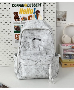 Detail of grey marble pattern backpack with logo, multi-pocket and thick handle