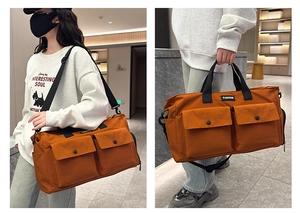 Dual view of large burnt orange travel bag showing shoulder and handbag carry styles