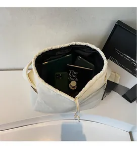 Detailed interior view of a large cream canvas tote bag showing spacious storage capacity