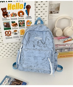 Detail showing the light blue snowflake texture canvas fabric and front zip pocket