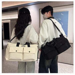 Travel bags in black and beige showing large front pockets and shoulder straps
