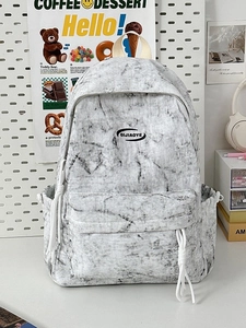 Minimalist marble pattern backpack for women with white straps and hanging zip cord detail