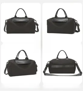 Detail of black waterproof gym bag with trolley sleeve and adjustable shoulder strap
