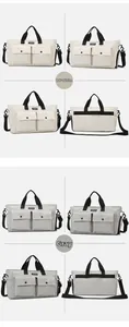 Detail view of large travel bags in beige and grey with front pockets and dual handles