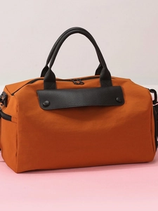 Large capacity orange fitness travel bag with black leather accents and dual handles