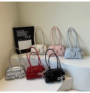 Collection of shiny leather shoulder bags with pearl bow charms in six assorted colors