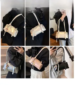 Fashionable underarm shoulder bags in white silver pink and black with cute doll charms