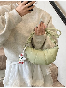 Green crescent shoulder bag with lychee texture and woven knot strap for women