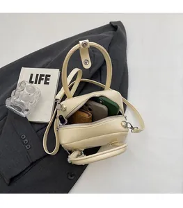 Spacious interior of the cream PU leather crossbody bag showing daily essentials