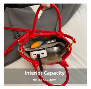 Internal view of red leather bucket bag showing large capacity for essentials