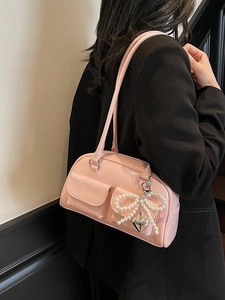 Pink glossy faux leather underarm bag with pockets and pearl bow heart charm