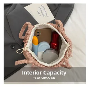 Top-down view of pink woven bucket bag interior showing capacity for phone and cosmetics
