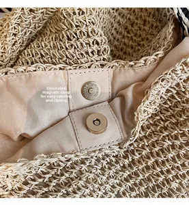 Detail of internal magnetic snap closure and light fabric lining on straw tote bag