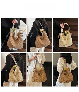 Detail view of woven straw tote bag with tribal pattern straps and large capacity design