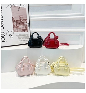 Detailed display of five colorful mini square handbags in various vibrant shades