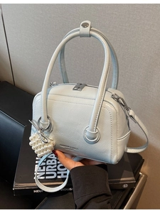 Elegant light blue mini Boston bag with pearl heart charm and adjustable strap