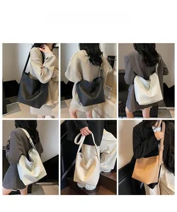 Vues détaillées du sac seau en cuir noir, crème et marron avec large bandoulière réglable