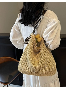 Handmade straw tote bag with black and white striped ribbon, bohemian vacation beach style