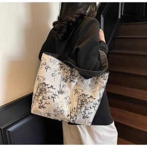 Detail of large canvas tote bag featuring artistic black and white ink bamboo print
