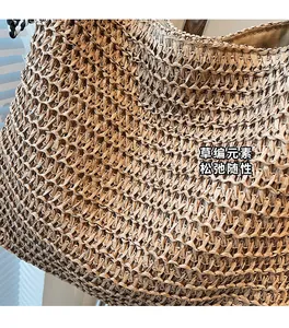 Close-up of the hollow woven pattern and straw texture on this summer beach bag