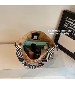 Top-down view of woven straw beach bag showing large capacity for essentials