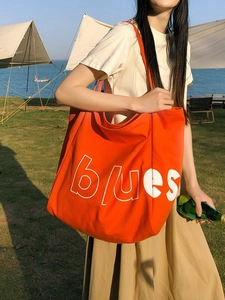 Grand sac cabas en toile orange vif avec inscription blues blanche pour le quotidien
