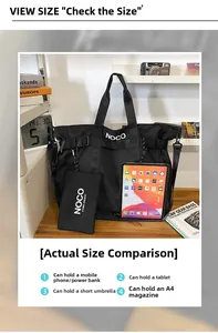 Close-up of black nylon tote bag interior showing large capacity for iPad and A4 magazine