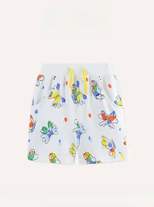 Detail of girls' cotton shorts with butterfly print and yellow drawstring waist