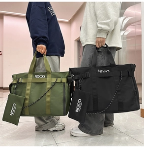 Detail of olive green and black nylon tote bags featuring a small detachable pouch