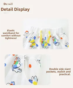 Detail of elastic waist with yellow drawstring and butterfly print on girls' cotton shorts