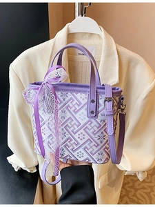 Modern purple and white geometric bucket bag with lace bow and leather handle