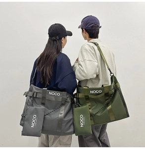 Detail of grey and olive tote bags in waterproof nylon with NOCO logo and small pouch