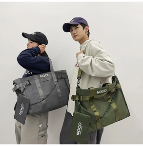 Detail of waterproof nylon tote bags showing adjustable straps and logo in grey and olive