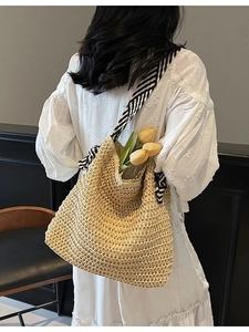 Straw shoulder tote bag with striped bow strap and floral decor for vacation