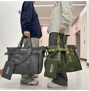 Detail of grey and green nylon tote bags with NOCO logo and woven strap accents