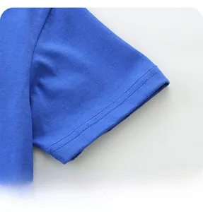 Detail shot of the double-stitched sleeve cuff on a blue knit cotton boys' t-shirt