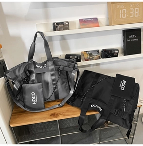 Detail view of large nylon tote bags with NOCO logo and matching small pouch