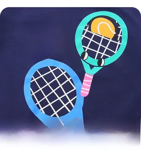 Detail of blue cotton kid's T-shirt showing Play Time tennis rackets printed design