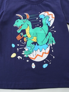 Boys navy blue cotton T-shirt featuring a cartoon dinosaur with Easter egg graphics
