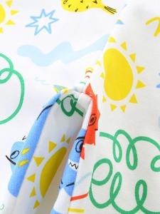Soft white knit cotton boy shorts featuring colorful cartoon sun and cloud prints