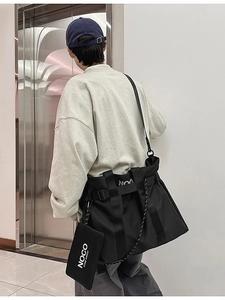 Fashionable black nylon tote bag with wide strap and small detachable coin purse