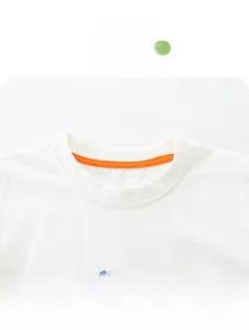 Detail of kids white cotton tee featuring a crew neck and colorful racing car print