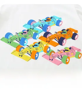 Detail of colorful cartoon race car prints on a soft white cotton kids t-shirt