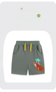Detail of grey-green cotton shorts featuring tiger embroidery and yellow drawstring