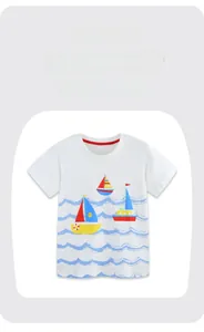 Close-up of boys white cotton T-shirt featuring colorful sailboat prints and crew neck