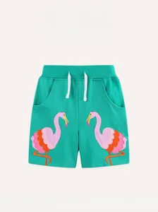 Détail du short fille en coton turquoise avec broderie flamant rose et cordon serrage