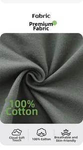 Detail showing 100% cotton fabric texture on dark green boy's shorts, soft and breathable