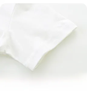 Close-up of double-needle stitching on the white cotton sleeve of a boy's T-shirt
