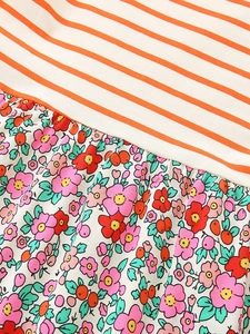 Abito smanicato da bambina con strisce arancioni e dettagli floreali patchwork