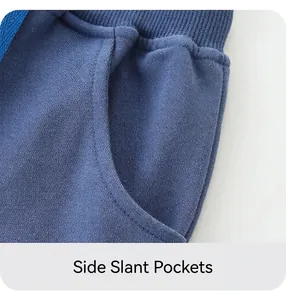 Detail of blue cotton shorts featuring an elastic ribbed waistband and drawstring cord